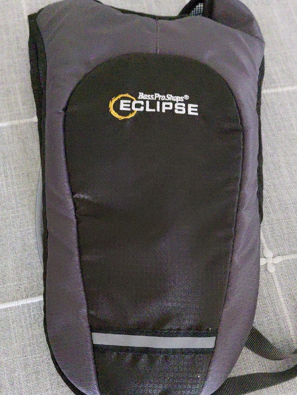 Bass Pro Shops Black and Gray Eclipse Hydration Pack with Orange Logo Accent